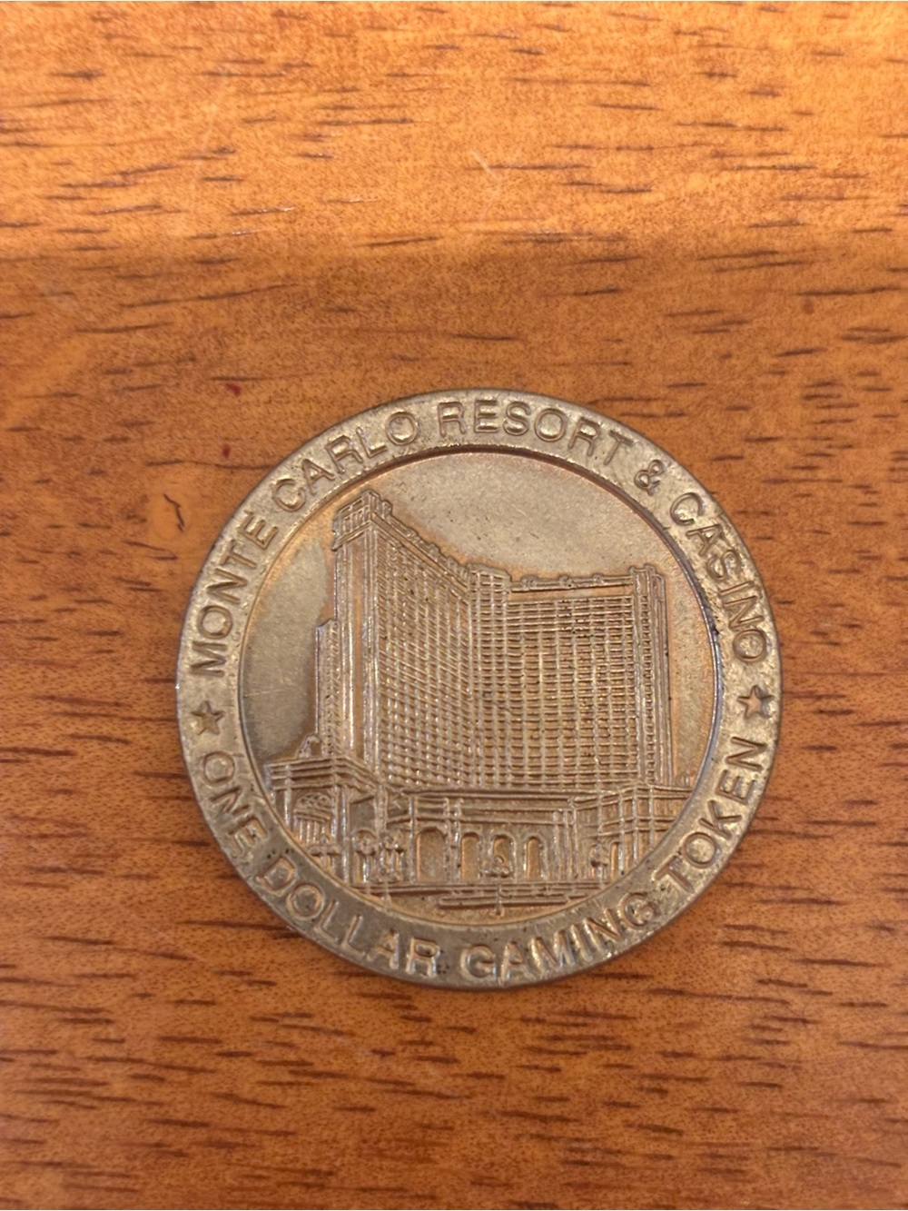 1996 Monte Carlo Las Vegas Resort & Casino One Dollar Gaming Token - Silver Tone